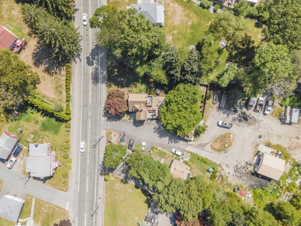 an aerial view of a yard with chairs