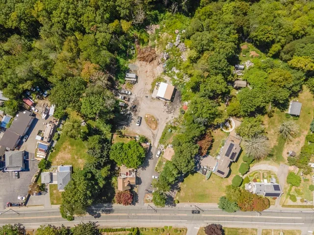 an aerial view of residential houses with outdoor space