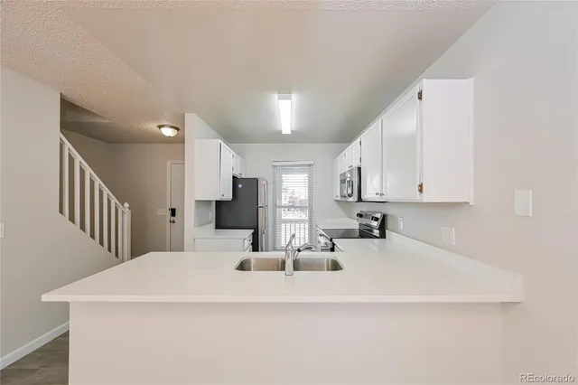 a view of kitchen with sink