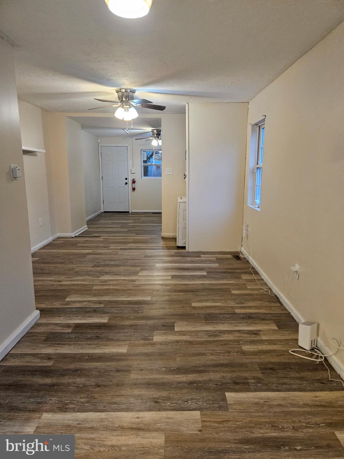 229 Sinnickson Street Salem, NJ 08079 - Photo 3 of 12 a view of empty room with wooden floor