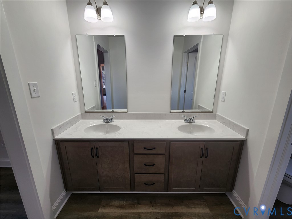 2545 Wickham Road Bumpass, VA 23024 - Photo 16 of 23 a bathroom with a granite countertop sink and a mirror