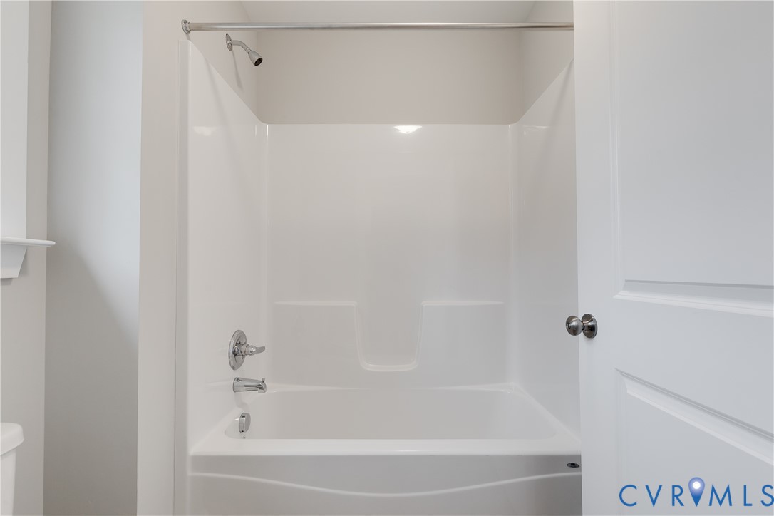 2545 Wickham Road Bumpass, VA 23024 - Photo 18 of 23 a close up of a bathtub in a bathroom