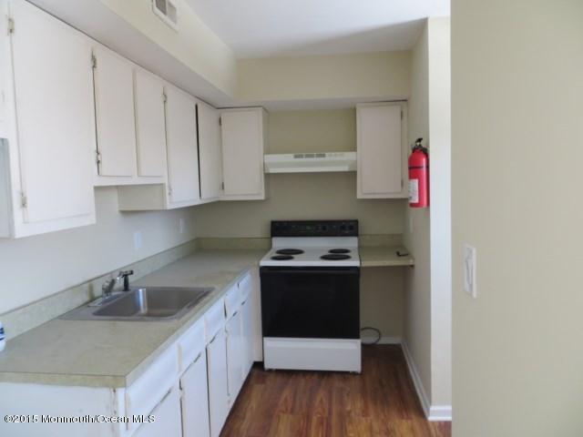 216 Sawmill Road Brick, NJ 08724 - Photo 3 of 11 a kitchen with stainless steel appliances granite countertop a sink stove and cabinets