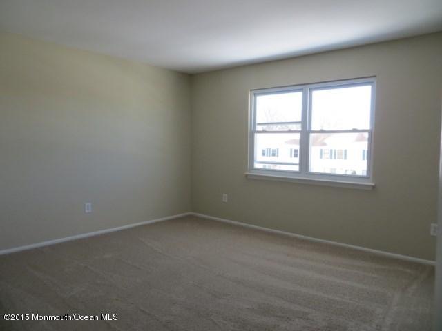 216 Sawmill Road Brick, NJ 08724 - Photo 5 of 11 an empty room with a window