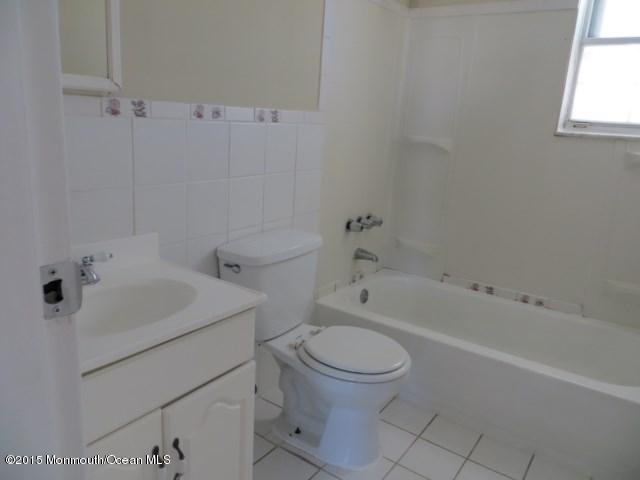 216 Sawmill Road Brick, NJ 08724 - Photo 7 of 11 a white toilet sitting next to a bath tub