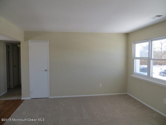 216 Sawmill Road Brick, NJ 08724 - Photo 10 of 11 an empty room with a window