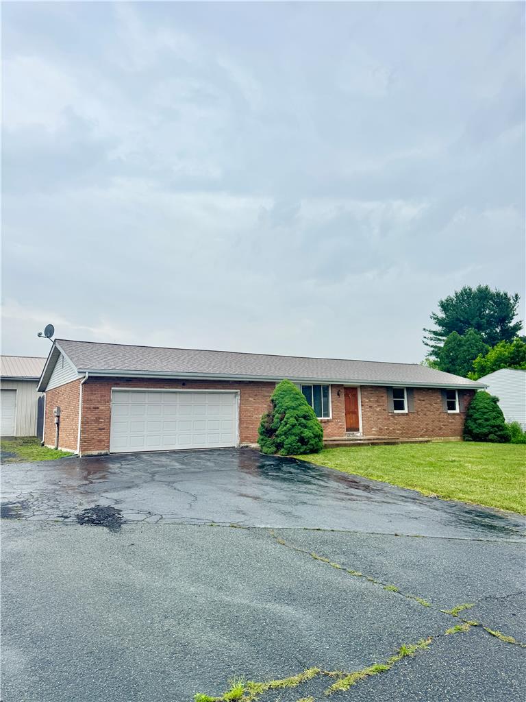 8325 Schantz Road Breinigsville, PA 18031 - Photo 2 of 21 A classic brick exterior offers enduring appeal and a broad driveway leads to the integrated garage.