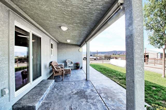 2135 M Road Grand Junction, CO 81505 - Photo 16 of 42 a view of a porch with furniture and yard