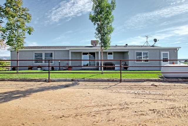 2135 M Road Grand Junction, CO 81505 - Photo 19 of 42 a view of a big yard next to a road