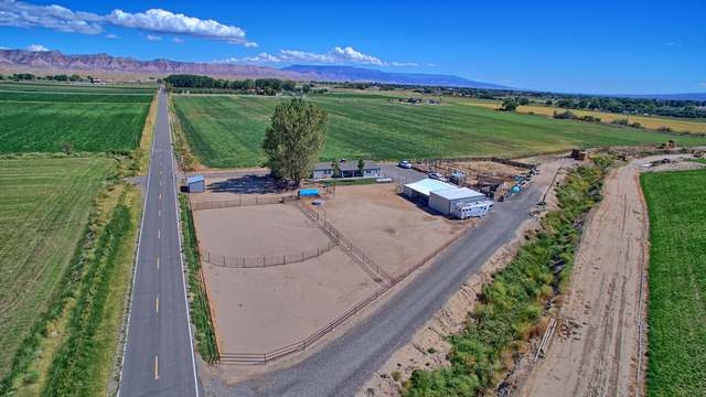 2135 M Road Grand Junction, CO 81505 - Photo 2 of 42 a view of a swimming pool with a yard