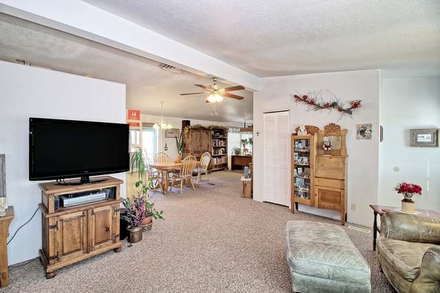 2135 M Road Grand Junction, CO 81505 - Photo 28 of 42 a living room with furniture and a flat screen tv