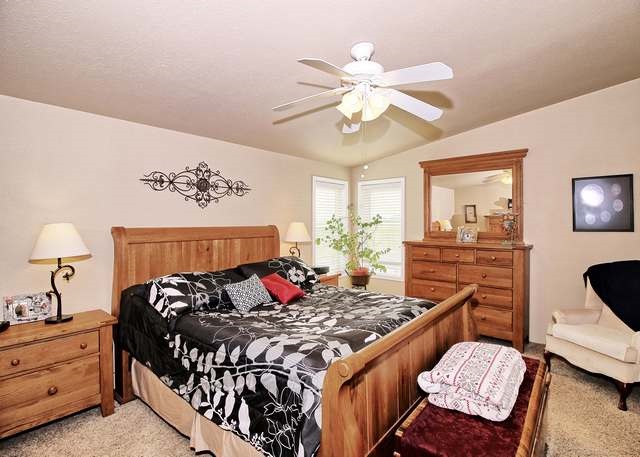 2135 M Road Grand Junction, CO 81505 - Photo 38 of 42 a bed room with a bed and a chandelier