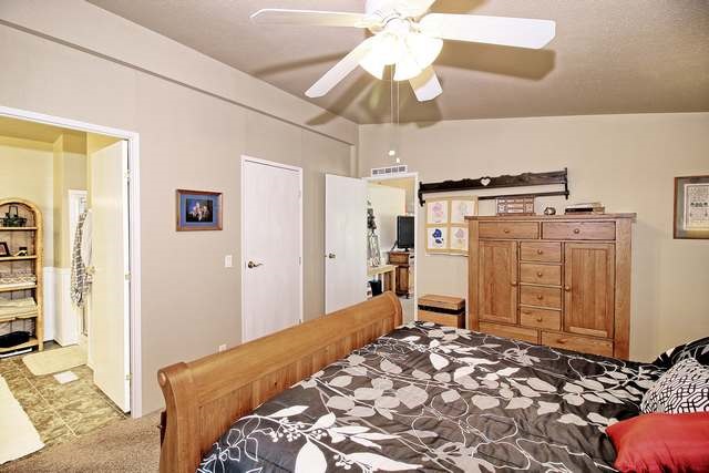 2135 M Road Grand Junction, CO 81505 - Photo 39 of 42 a bedroom with a bed and a chandelier