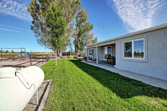 2135 M Road Grand Junction, CO 81505 - Photo 7 of 42 a view of a backyard with sitting area