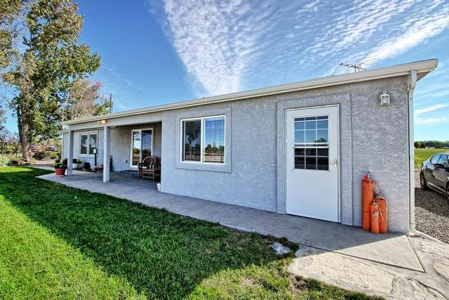 2135 M Road Grand Junction, CO 81505 - Photo 8 of 42 a front view of a house with a yard