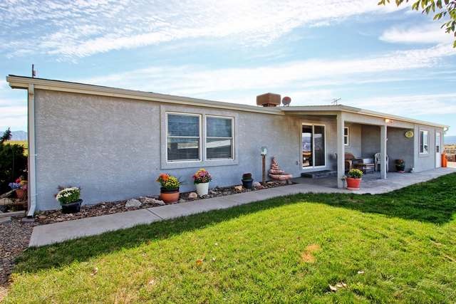 2135 M Road Grand Junction, CO 81505 - Photo 10 of 42 a view of a house with backyard porch and sitting area