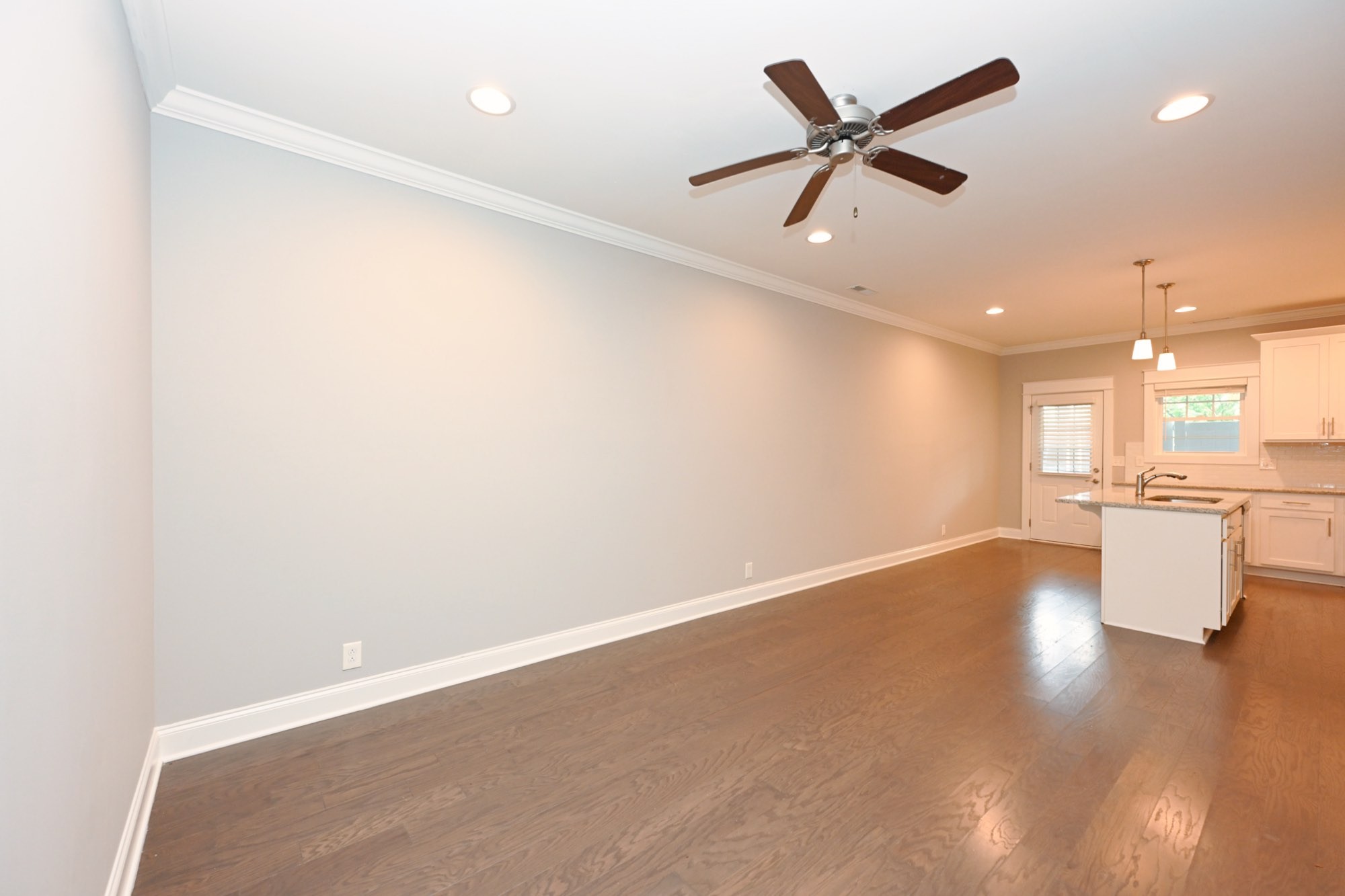 1019 North Maple Street, Unit 2D Murfreesboro, TN 37130 - Photo 12 of 56 an empty room with wooden floor and a ceiling fan