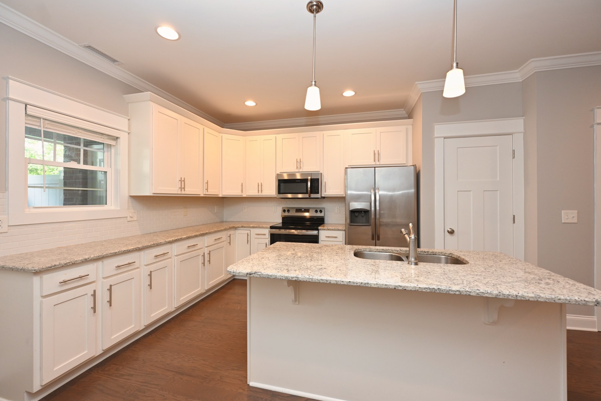 1019 North Maple Street, Unit 2D Murfreesboro, TN 37130 - Photo 21 of 56 a kitchen with stainless steel appliances granite countertop a sink refrigerator and cabinets