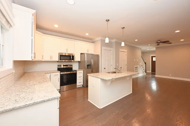a kitchen with a stove and a sink