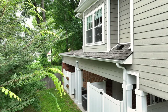 an aerial view of a house with patio and garden