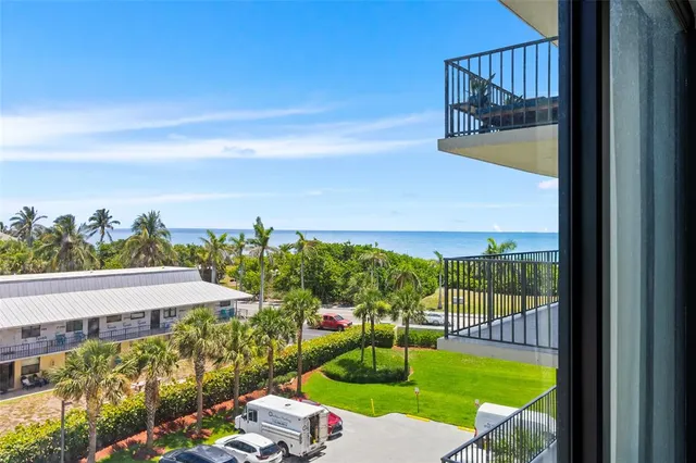 a view of a balcony with an ocean view