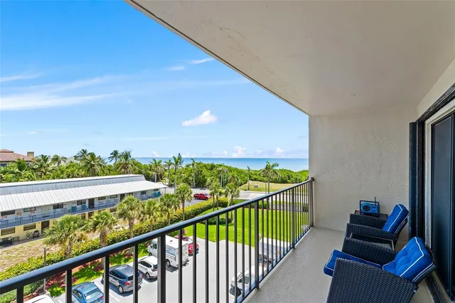 a view of a balcony with furniture