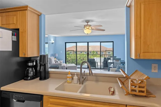 a kitchen with a table a stove and cabinets