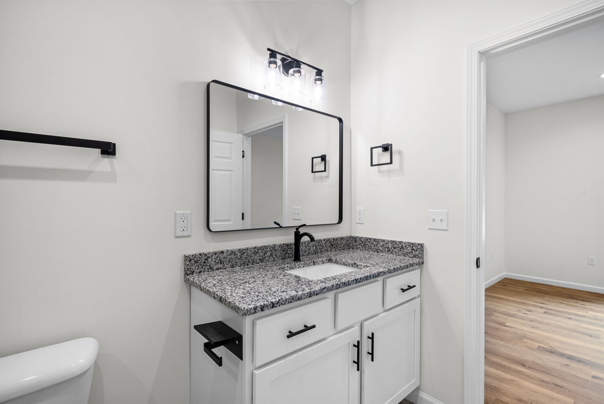 690 Brazzle Road Waverly, TN 37185 - Photo 20 of 35 a bathroom with a granite countertop sink and a mirror