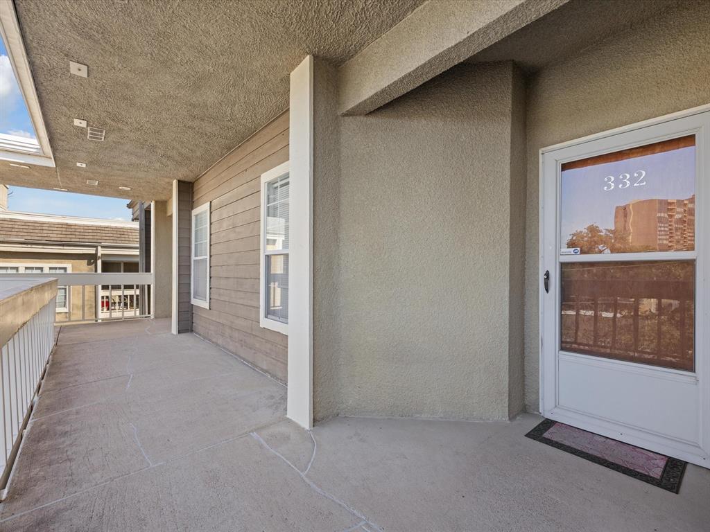 5310 Keller Springs Road, Unit 332 Dallas, TX 75248 - Photo 37 of 39 Property entrance featuring stucco siding