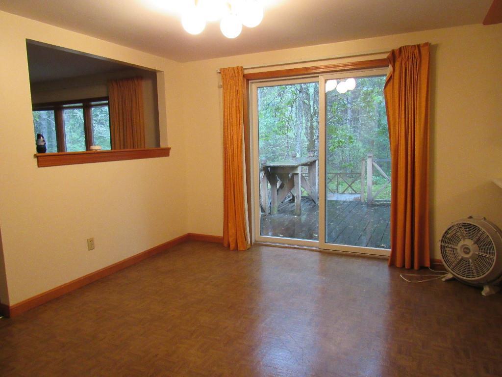 439 Perry Oliver Road Wells, ME 04090 - Photo 8 of 17 Dining area with sliders leading to...