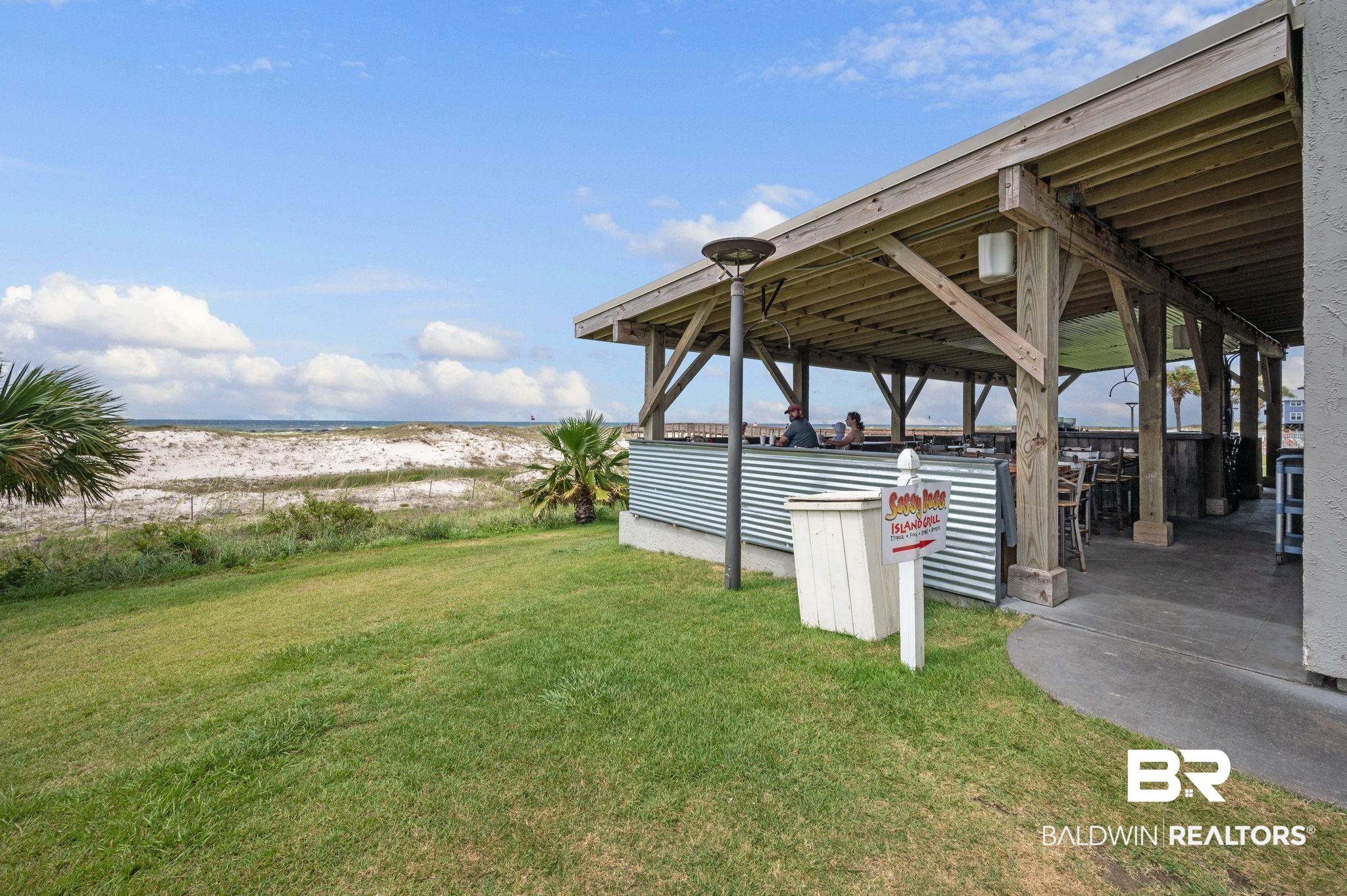 375 Plantation Road, Unit 5304 Gulf Shores, AL 36542 - Photo 33 of 42 View of grassy yard featuring view of water and beach