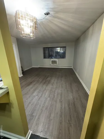 a view of an empty room and a window