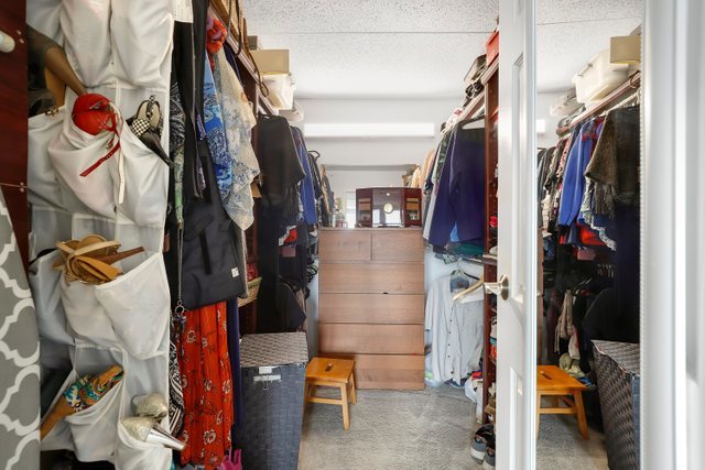 2005 South Finley Road, Unit 703 Lombard, IL 60148 - Photo 16 of 30 a view of walk in closet with clothes and shoes