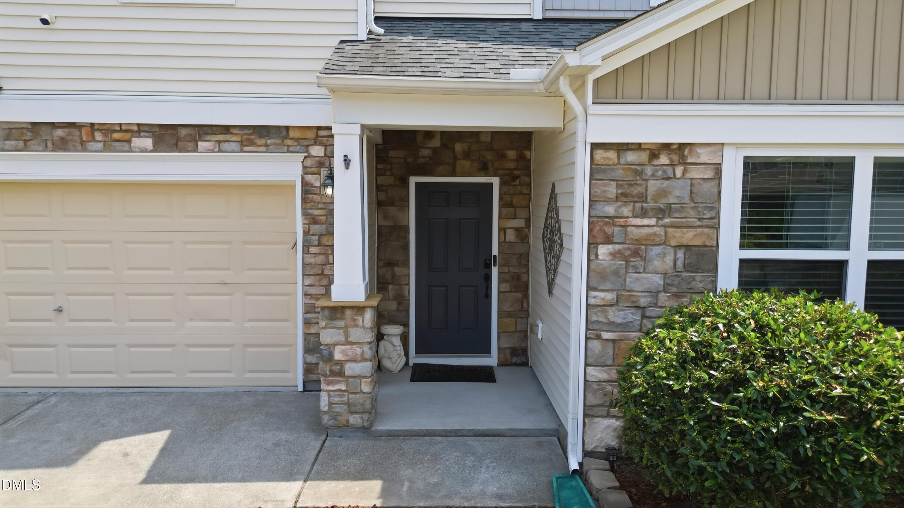 8128 Hovingham Way Raleigh, NC 27616 - Photo 36 of 40 a front view of a house with a garden
