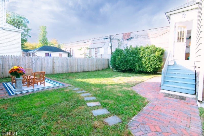 306 Springfield Avenue, Unit 1 Summit, NJ 07901 - Photo 13 of 17 a view of a backyard with a patio
