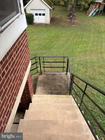 a view of a backyard with sitting area