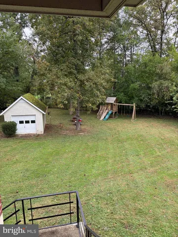 a view of a room with shelves and entertaining space