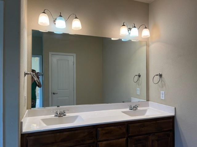 1716 Kachina Lodge Road Fort Worth, TX 76131 - Photo 13 of 21 a bathroom with a sink and a mirror