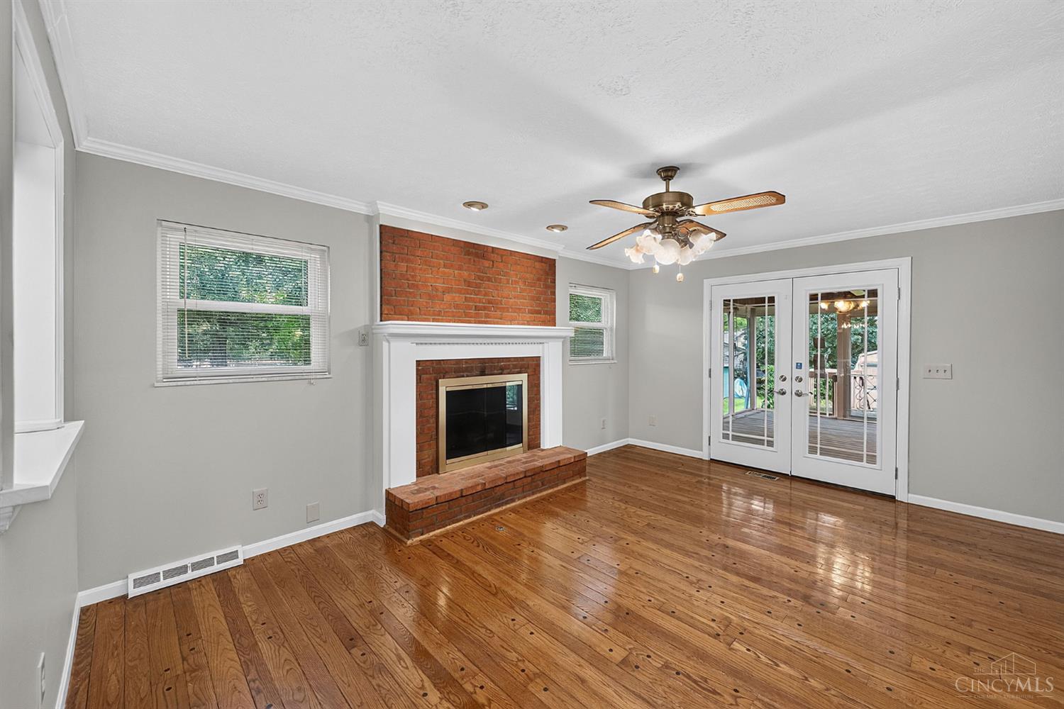 2086 Resor Road Fairfield, OH 45014 - Photo 14 of 42 Family room fireplace creates a comfortable focal point while French doors connect indoor and outdoor living.