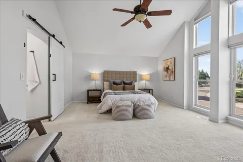 a bedroom with furniture and window