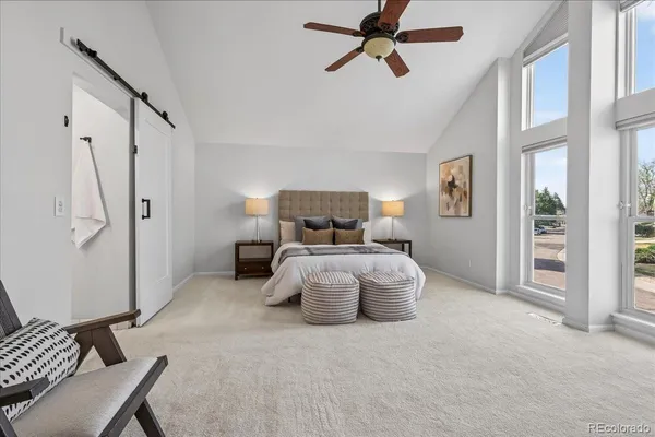 a bedroom with furniture and window