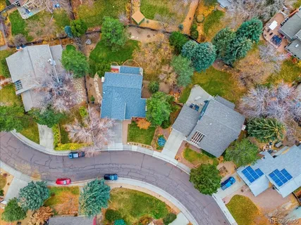 an aerial view of house with a yard