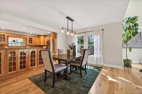 a view of a dining room with furniture window and wooden floor