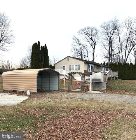 a view of mountain with green field