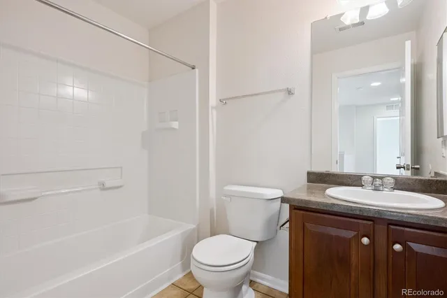 a view of a house with backyard and porch