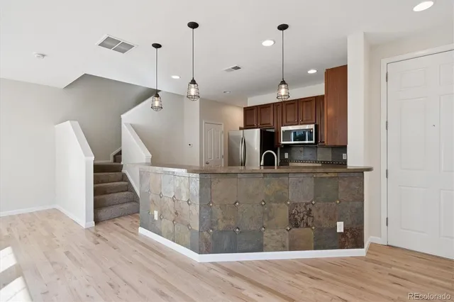 a view of kitchen and wooden floor