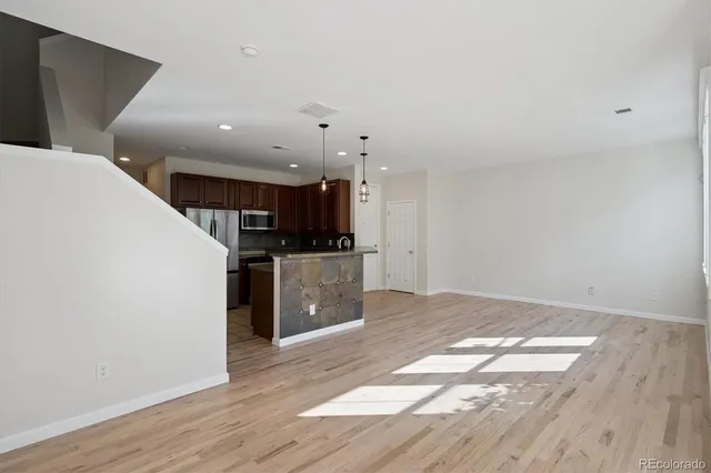a view of kitchen with wooden floor