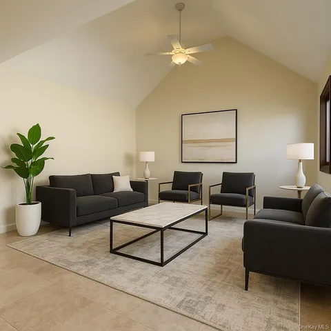 a living room with furniture a chandelier and a window