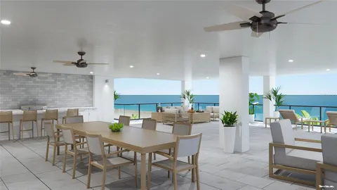 an open kitchen with dining table and chairs