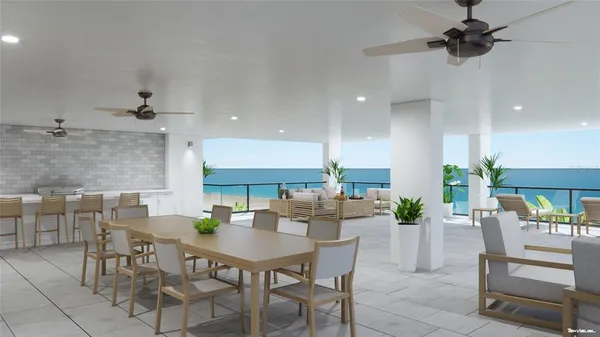 an open kitchen with dining table and chairs